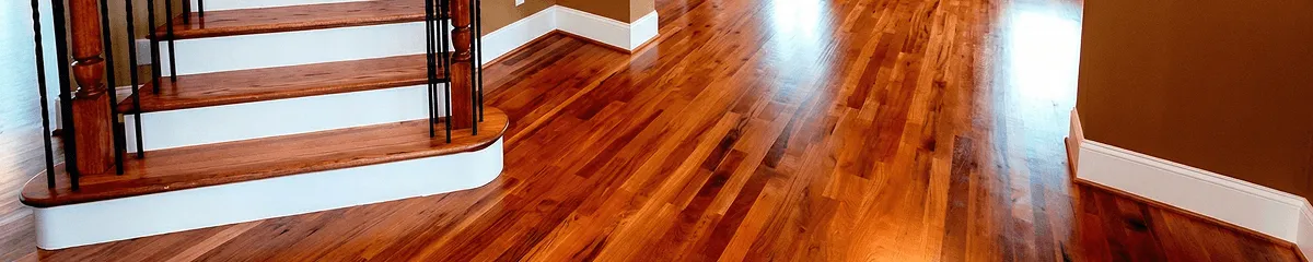 Base floor of a staircase with professionally restored wood flooring in Indianapolis IN